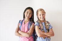 portrait-two-pretty-girls-with-backpacks